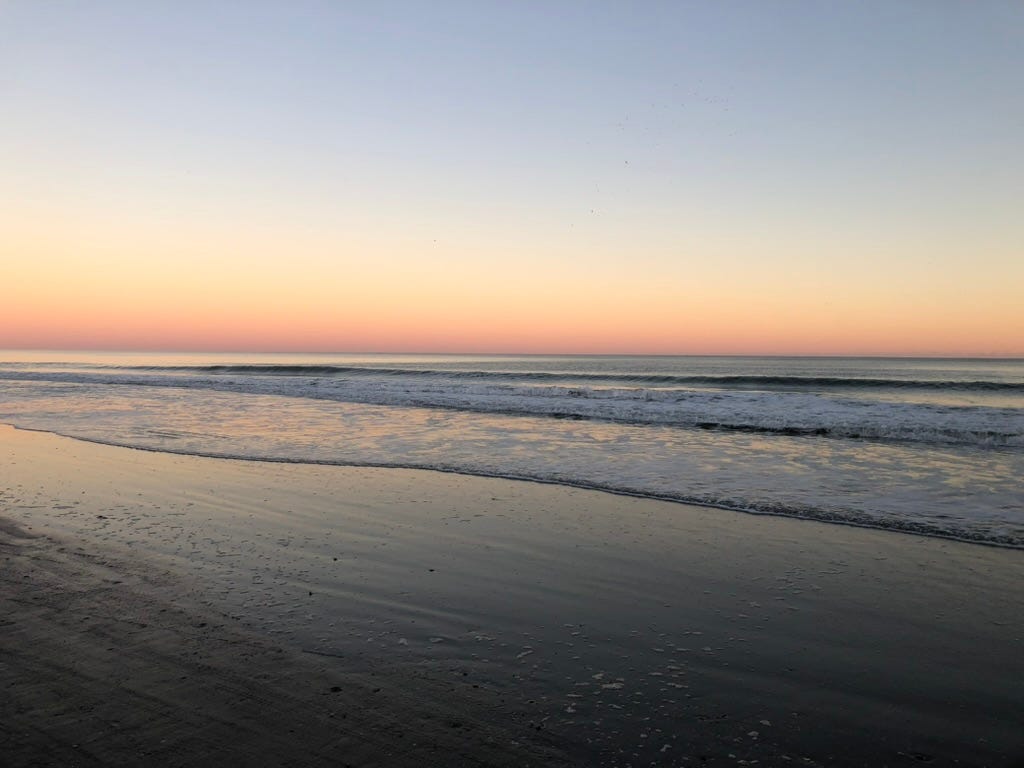 A beach with waves crashing on the shore
Description automatically generated A beach with waves crashing on the shore
Description automatically generated