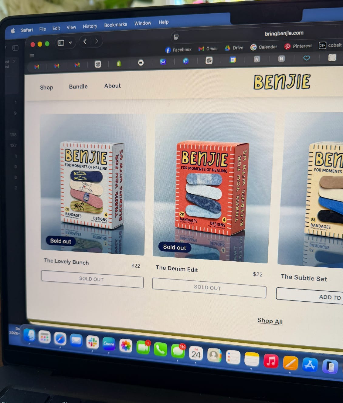 Laptop screen showing Benjie’s online store with multiple bandage products marked sold out after launch demand.