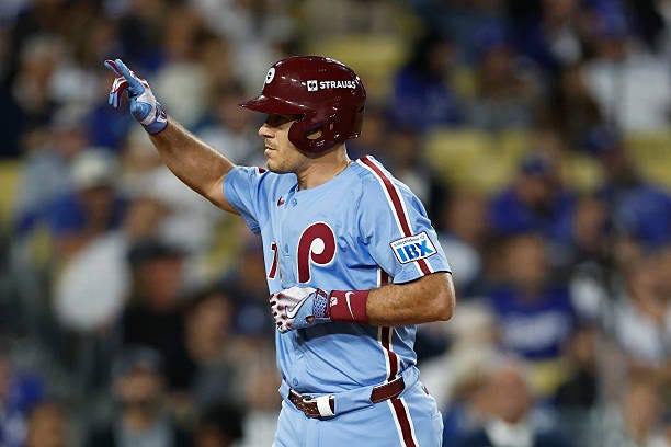 Realmuto of the Philadelphia Phillies reacts after hitting a solo home run against the Los Angeles Dodgers during the eighth inning in game three of...