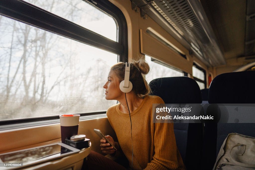 Young woman riding a train