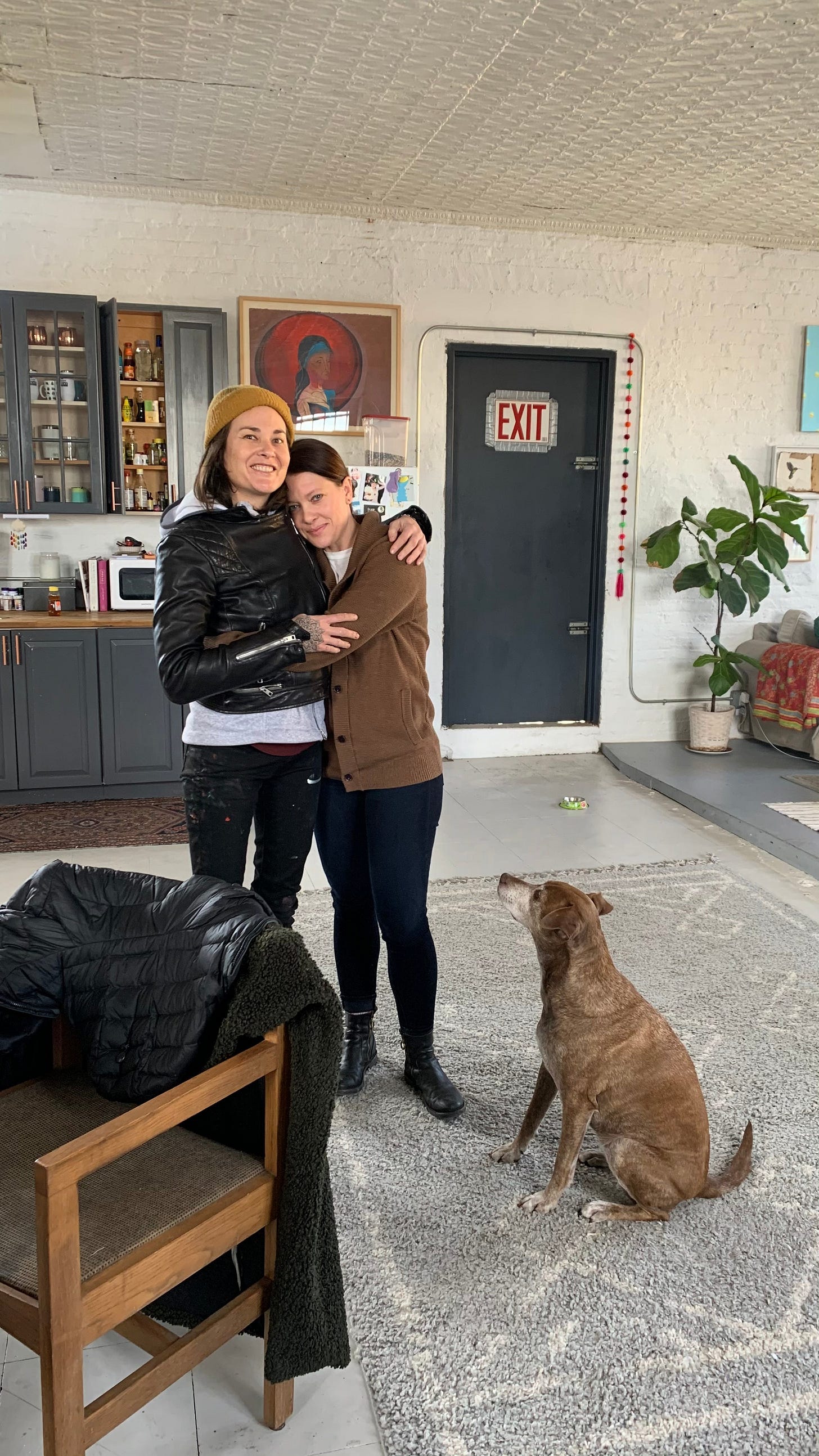 Ali, Emily, and Trempor in their loft