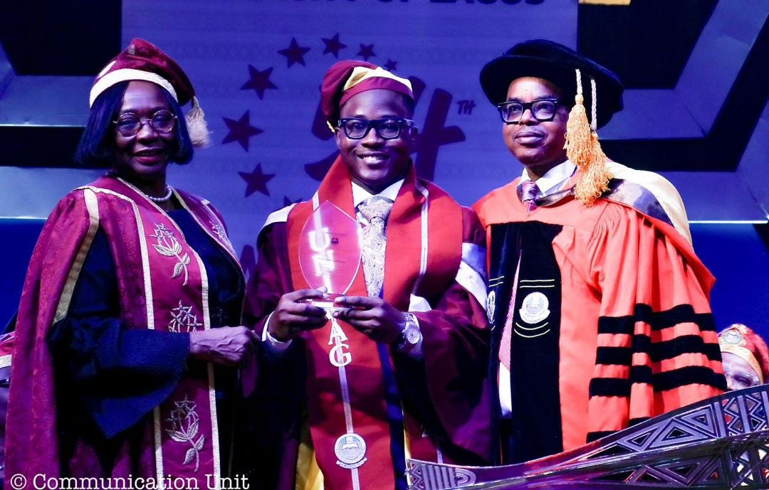 David Akanmu receiving an award