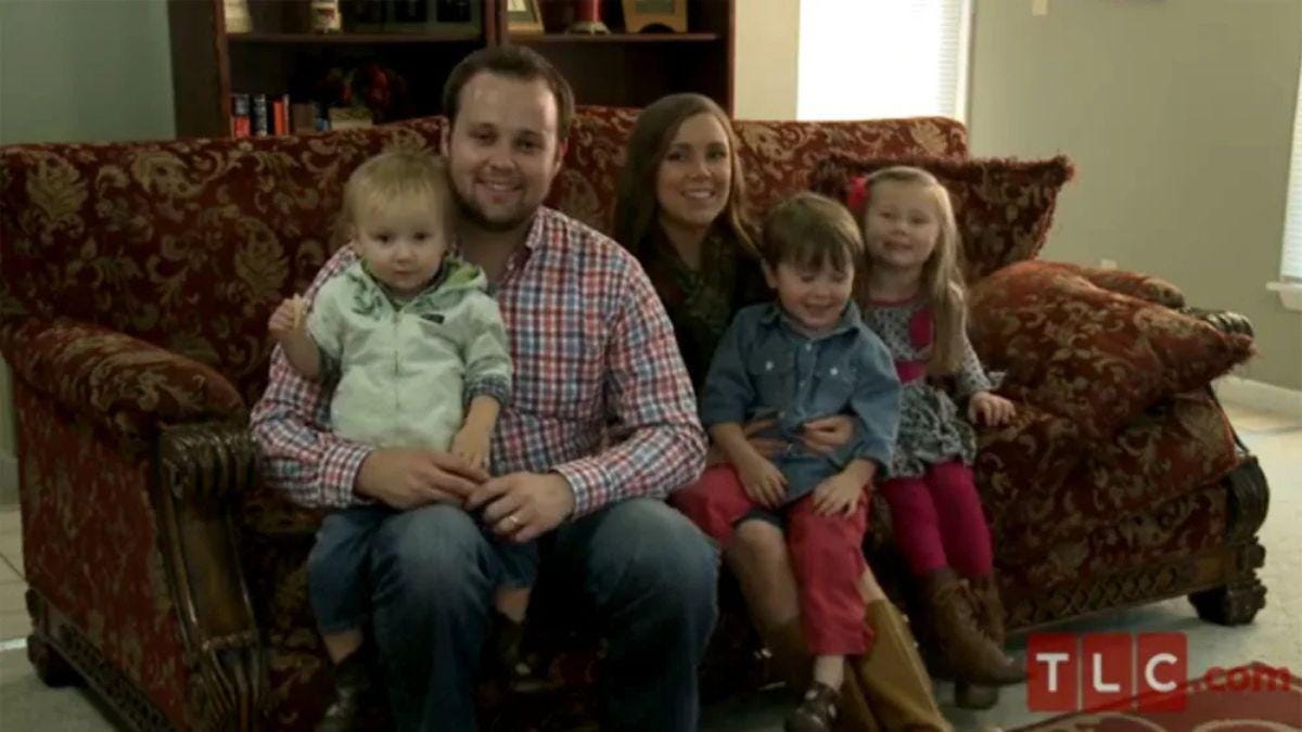 A photo of Josh and Anna Duggar with their children A photo of Josh and Anna Duggar with their children