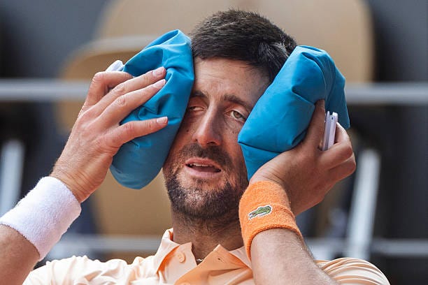 Novak Djokovic of Serbia cools off between games during his match against Joao Fonseca of Brazil on Court Philippe Chatrier in the third round of the... Novak Djokovic of Serbia cools off between games during his match against Joao Fonseca of Brazil on Court Philippe Chatrier in the third round of the...