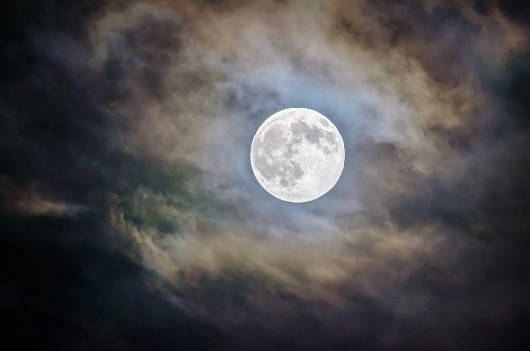 full moon and gray clouds during nighttime full moon and gray clouds during nighttime