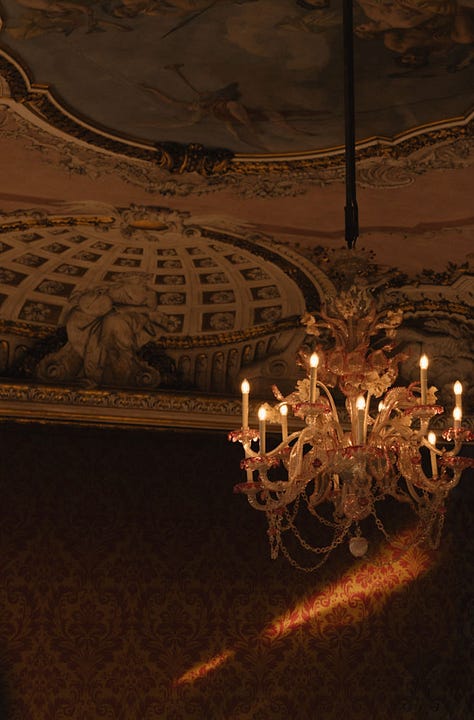 Aman Venice — water taxi, frescoed palazzo interiors, Murano chandelier, piano, and atmospheric details. Photographs by Sara Montalbano and Konstantinos Maximiadis.
