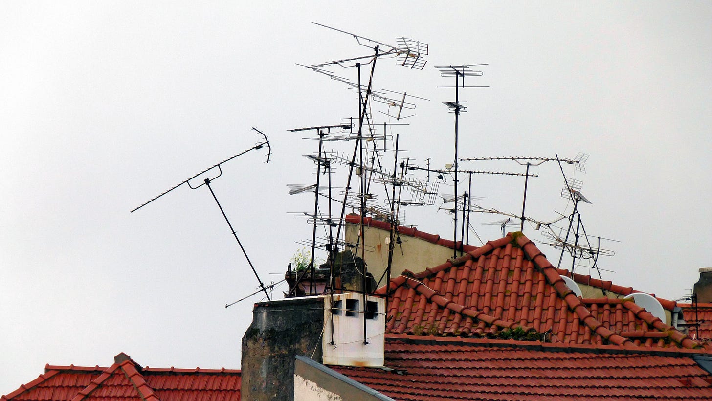 Tile roof bristling with TV antennas Tile roof bristling with TV antennas