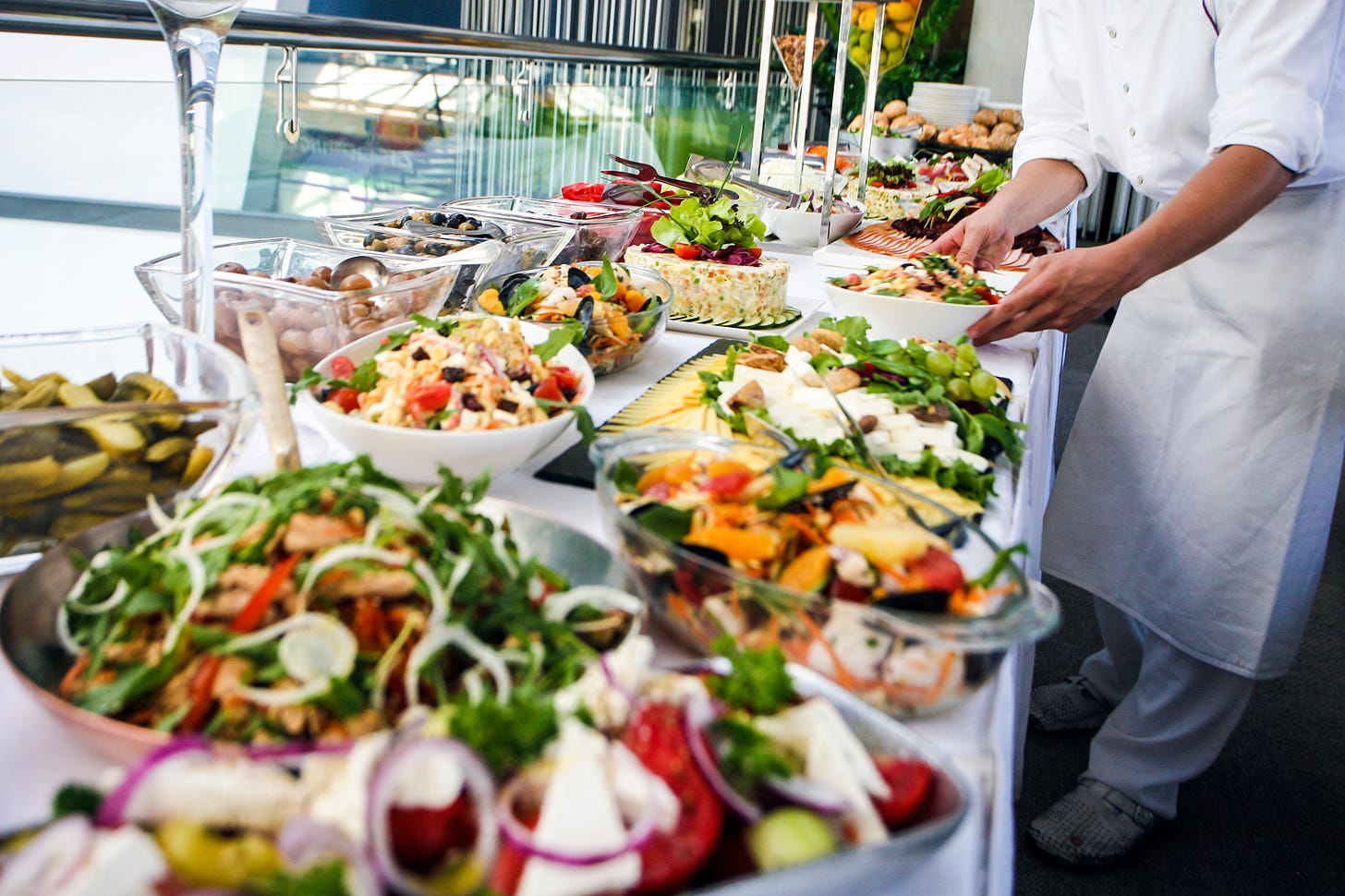 Buffet with a variety of foods ready to serve.
