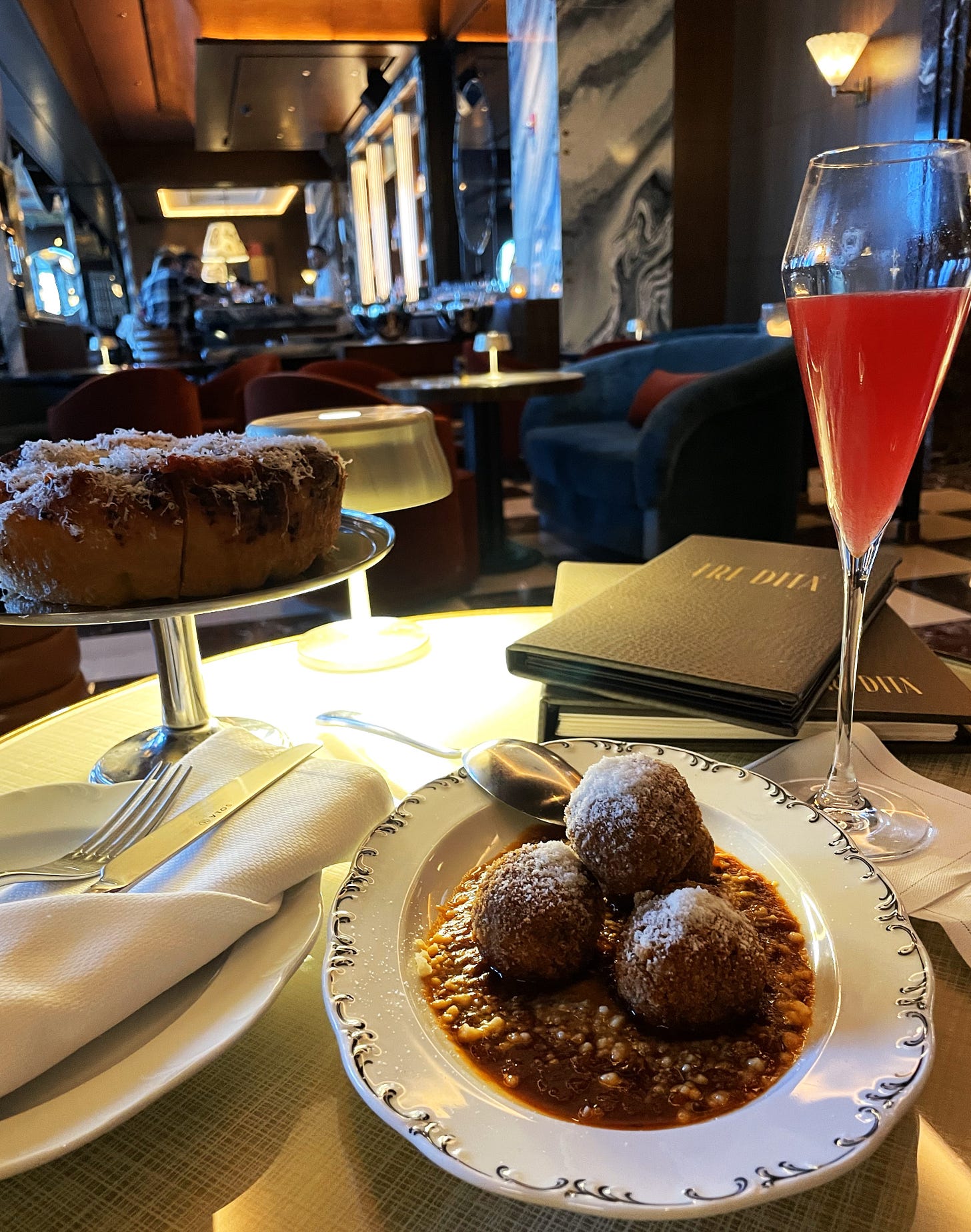 Schiacciata Rossa, Polpette Di Bollito, and the Golden Siren cocktail at Bar Tre Dita 