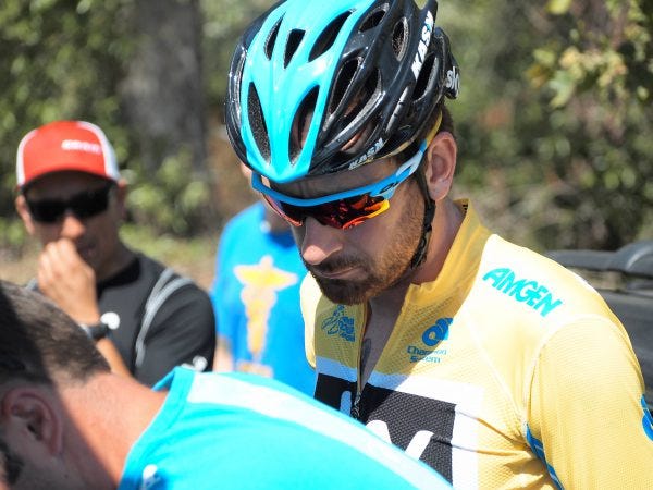 Wiggins eyes wheel adjustment moments before stage. Wiggins eyes wheel adjustment moments before stage.