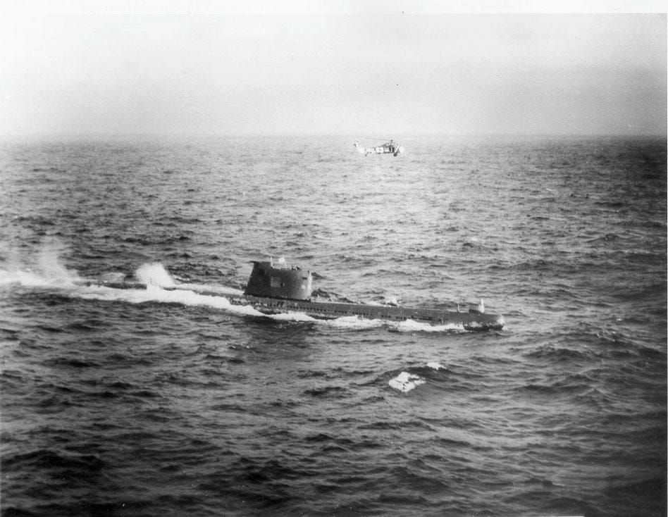 Soviet submarine B-59 during the Cuban Missile Crisis with a U.S. Navy helicopter flying directly over it. Soviet submarine B-59 during the Cuban Missile Crisis with a U.S. Navy helicopter flying directly over it.