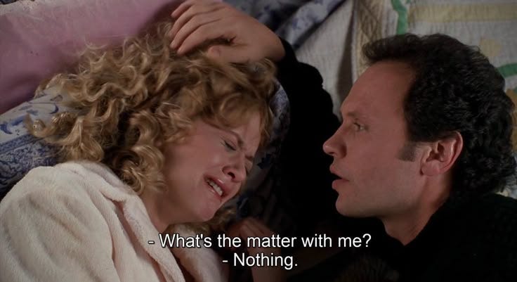 This may contain: a man and woman laying in bed with the caption what's the matter with me? nothing