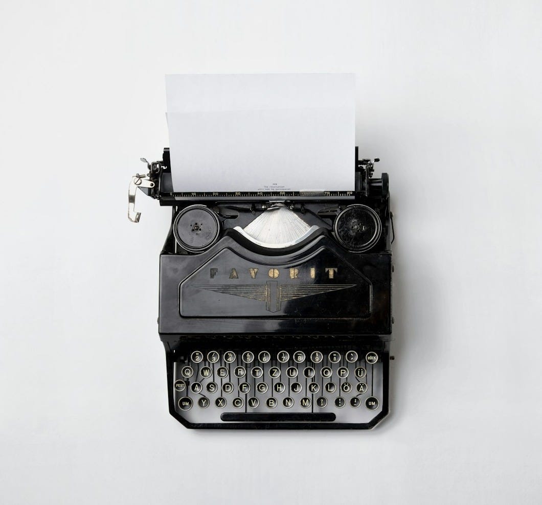 black Fayorit typewriter with printer paper