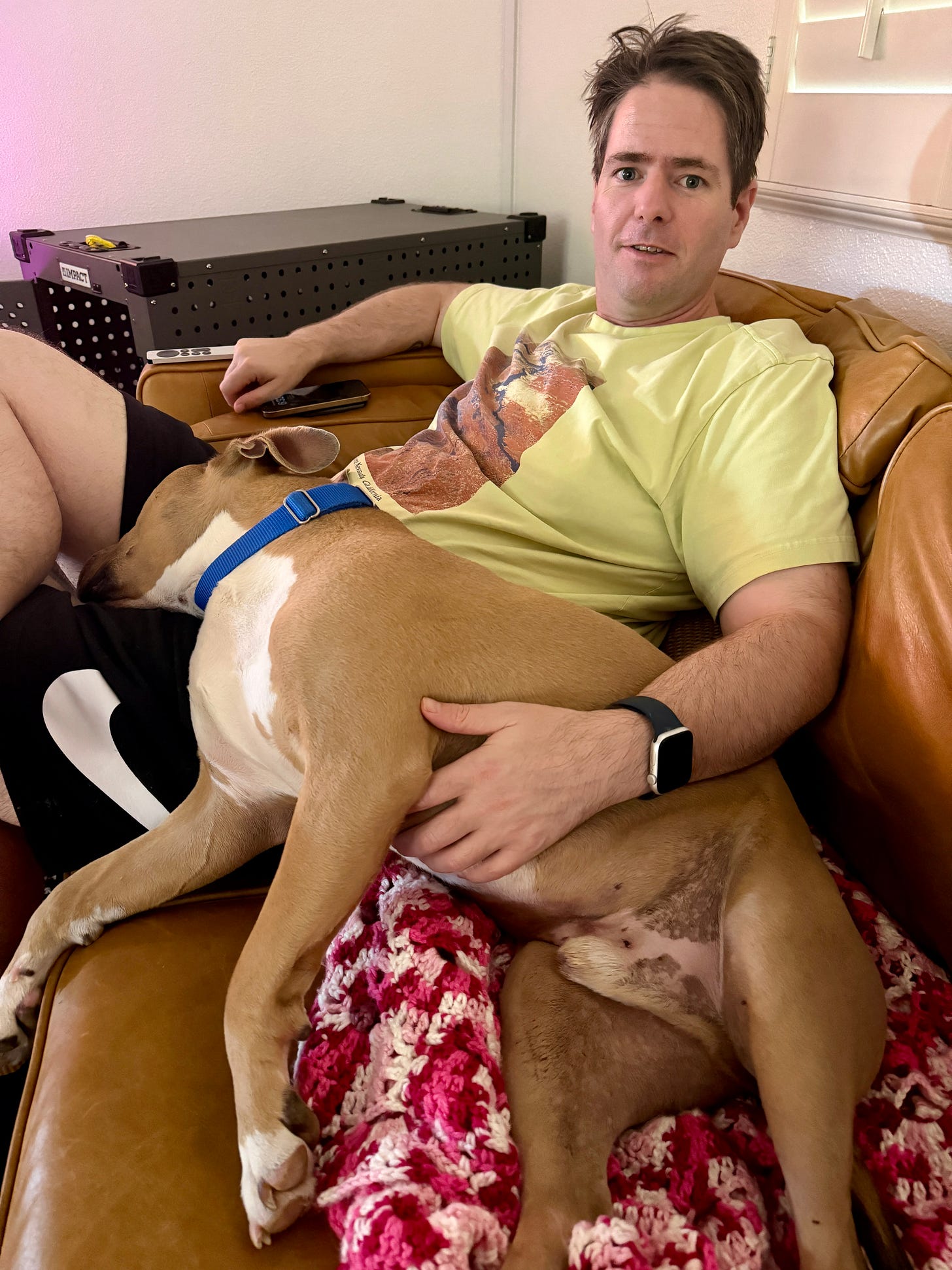 Elvis relaxing on a couch with Rob