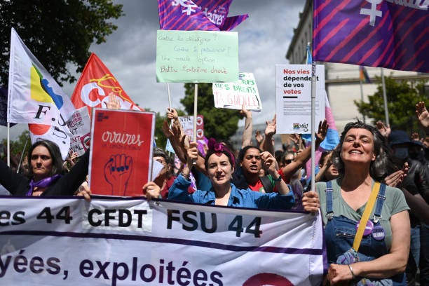 Demonstrators march with a placard reading «Against stereotypes? Against patriarchy, only one option, defeat the far-right» during an anti far-right...