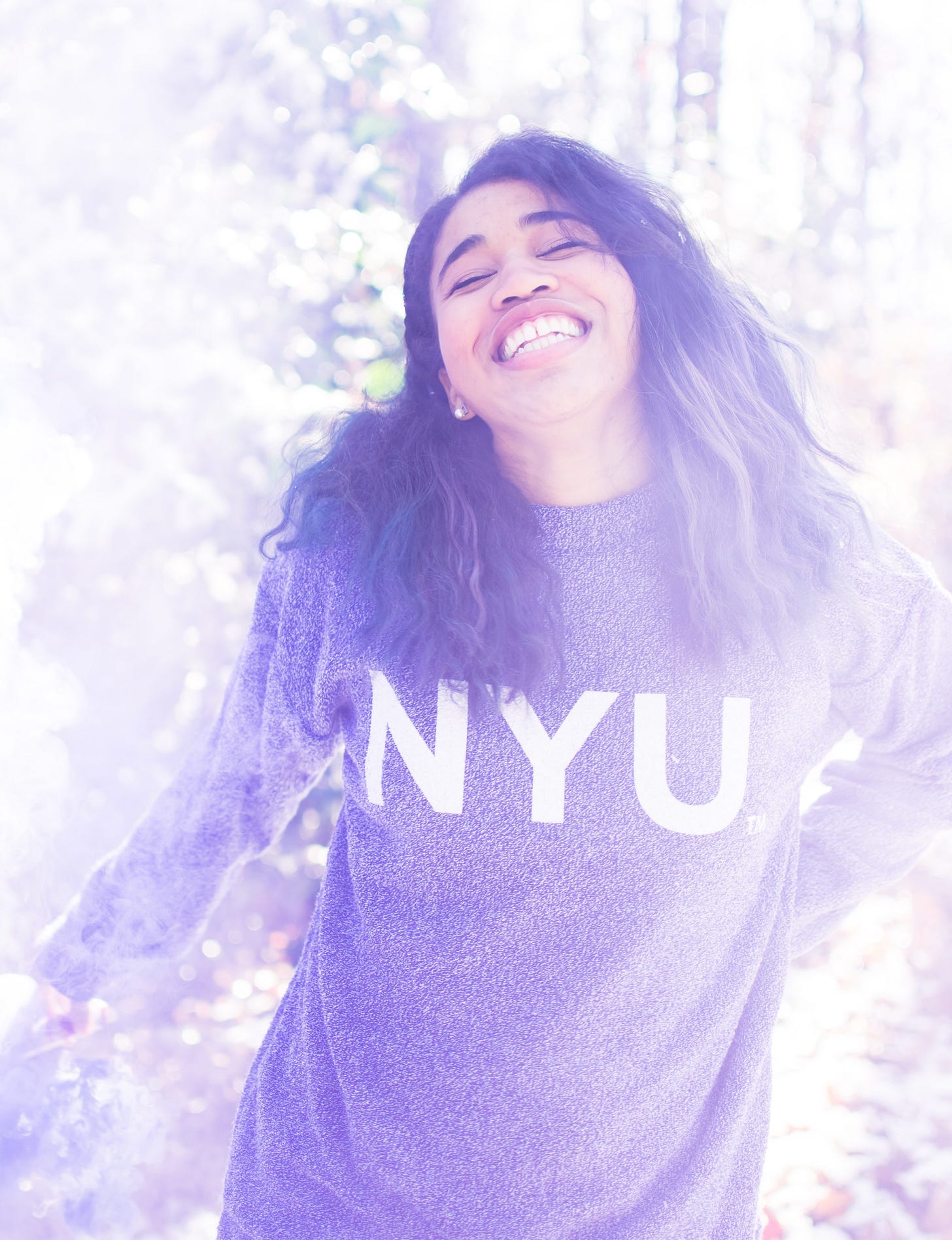 Kiana wearing an NYU sweatshirt