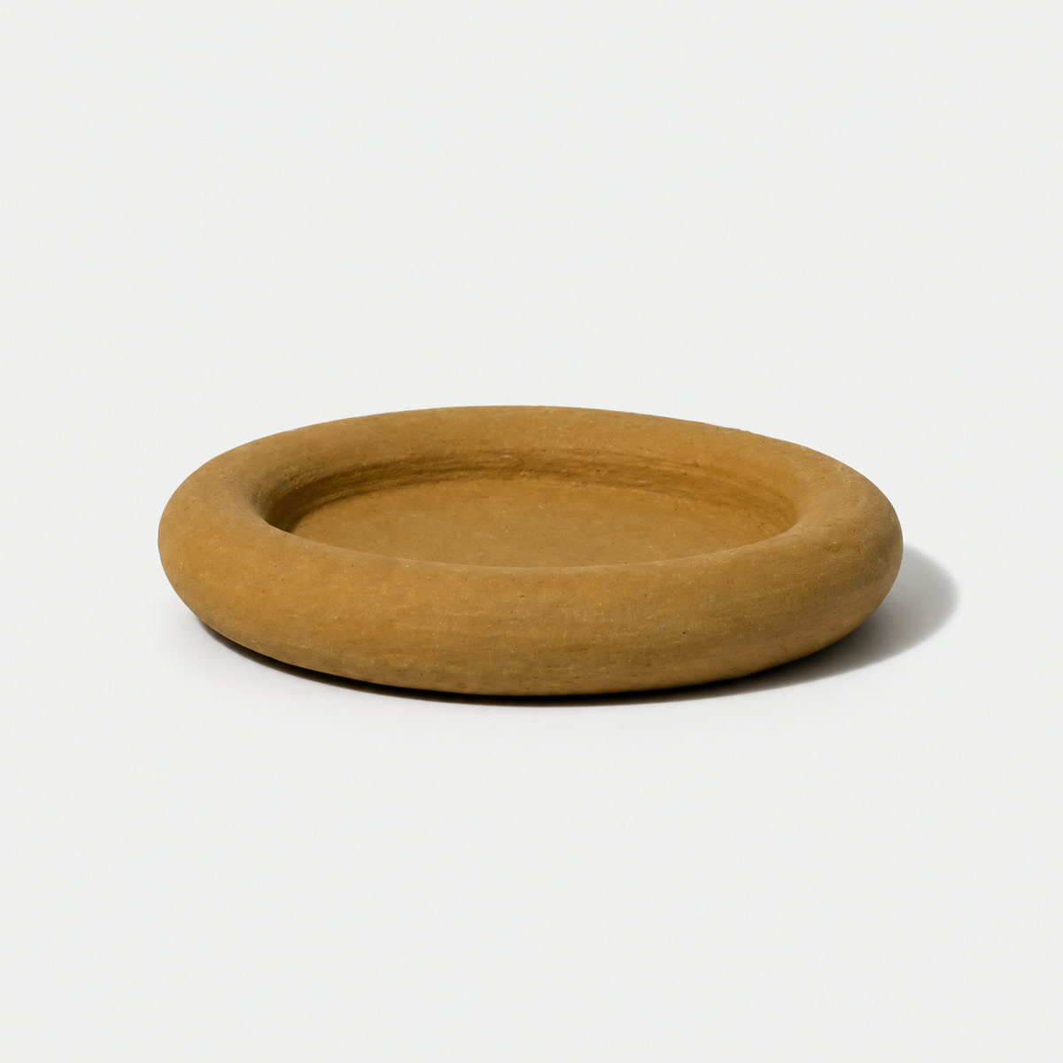 Hand-shaped clay plate made at Makerspace