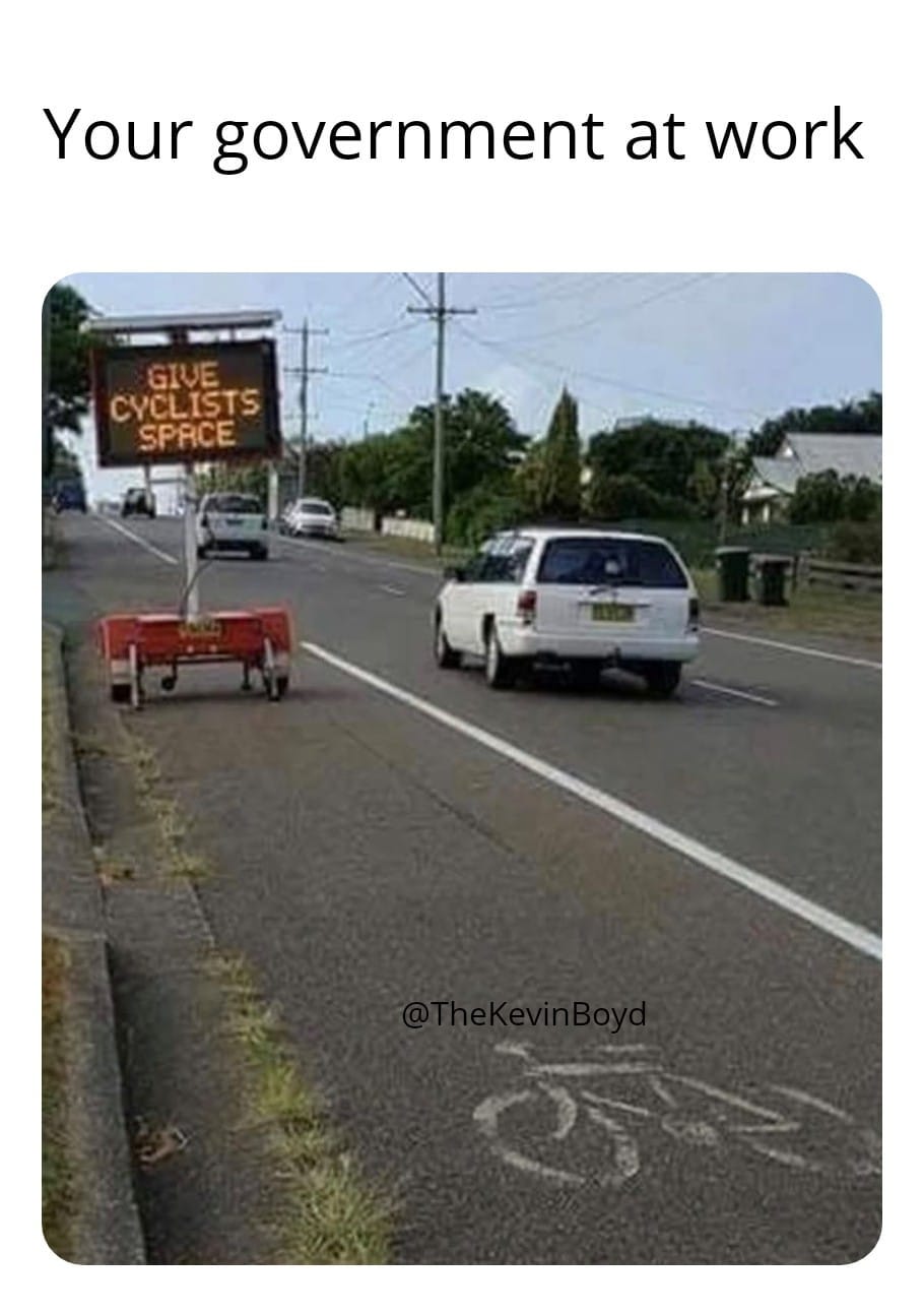 May be an image of road and text that says 'Your government at work S GIVE CYCLISTS SPRCE 然 FNA'