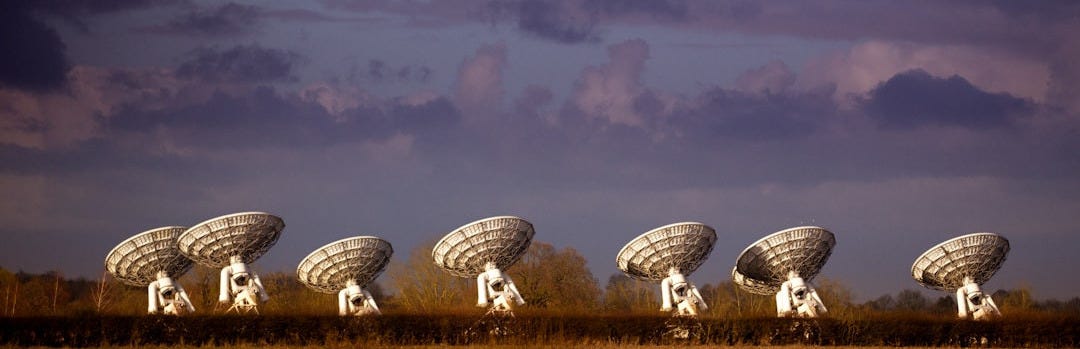 white round building under cloudy sky during daytime