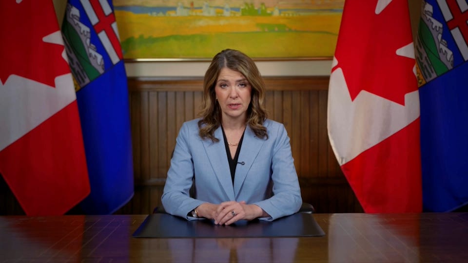 A person sitting at a desk with flags behind her

AI-generated content may be incorrect.