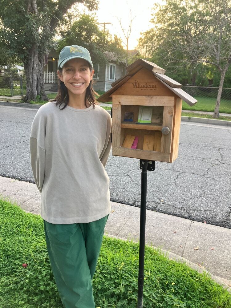 Nina bext to her seed library.