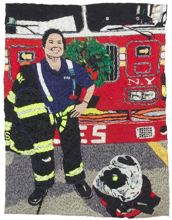 1) A white firefighter is standing in front a red firetruck with a green wreath on the front of it. The firetruck is from New York, and the firefighter has their jacket off. The person has short black hair and is smiling at the viewer. Their fire coat is black with yellow highlights. 2) The reverese of the embroidery is seen with threads and strings going different directions.