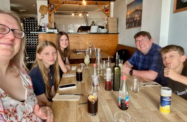 Paul with his family at a resturant