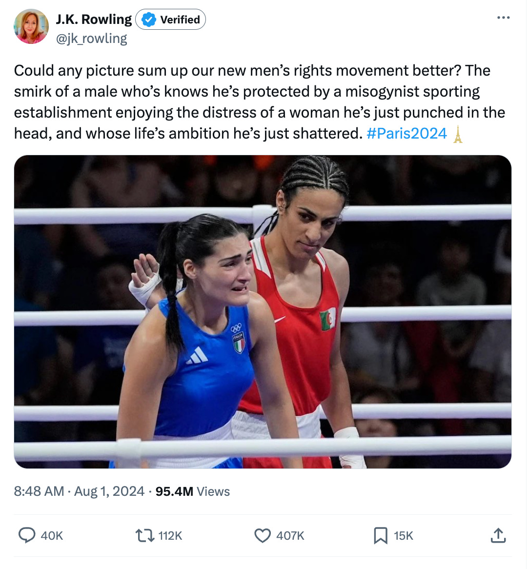 Woman in blue singlet cries as woman in red singlet pats her on the back with a neutral look on her face. 