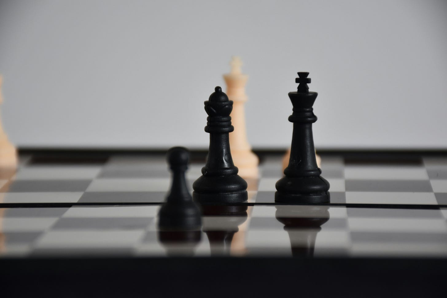 Photo of chess pieces on a chess board.
