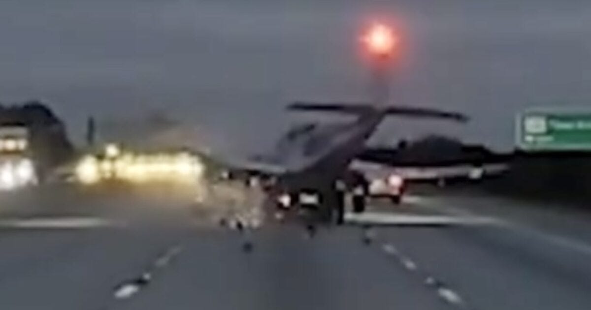 Small airplane landing on a highway with cars approaching, showcasing an unusual aviation emergency situation. Small airplane landing on a highway with cars approaching, showcasing an unusual aviation emergency situation.