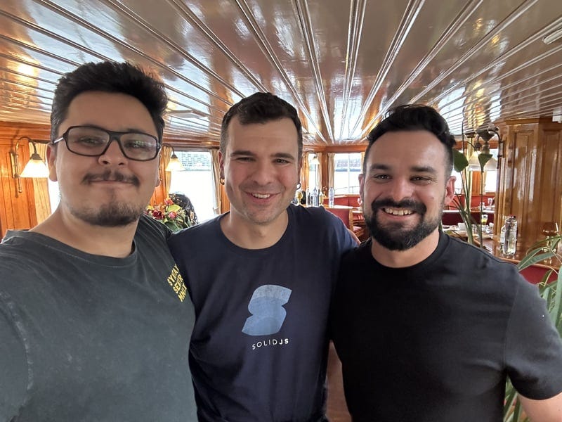 A photo of me, Ryan, and Atila at the React Summit speaker dinnerA photo of me, Ryan, and Atila at the React Summit speaker dinner
