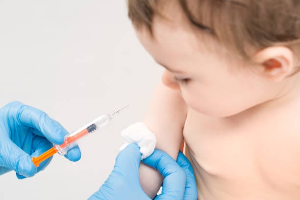 Vaccination little girl. vaccine vaccination child baby doctor injection pediatrician injecting arm health immunization hand hospital needle syringe concept - stock image baby vaccine stock pictures, royalty-free photos & images
