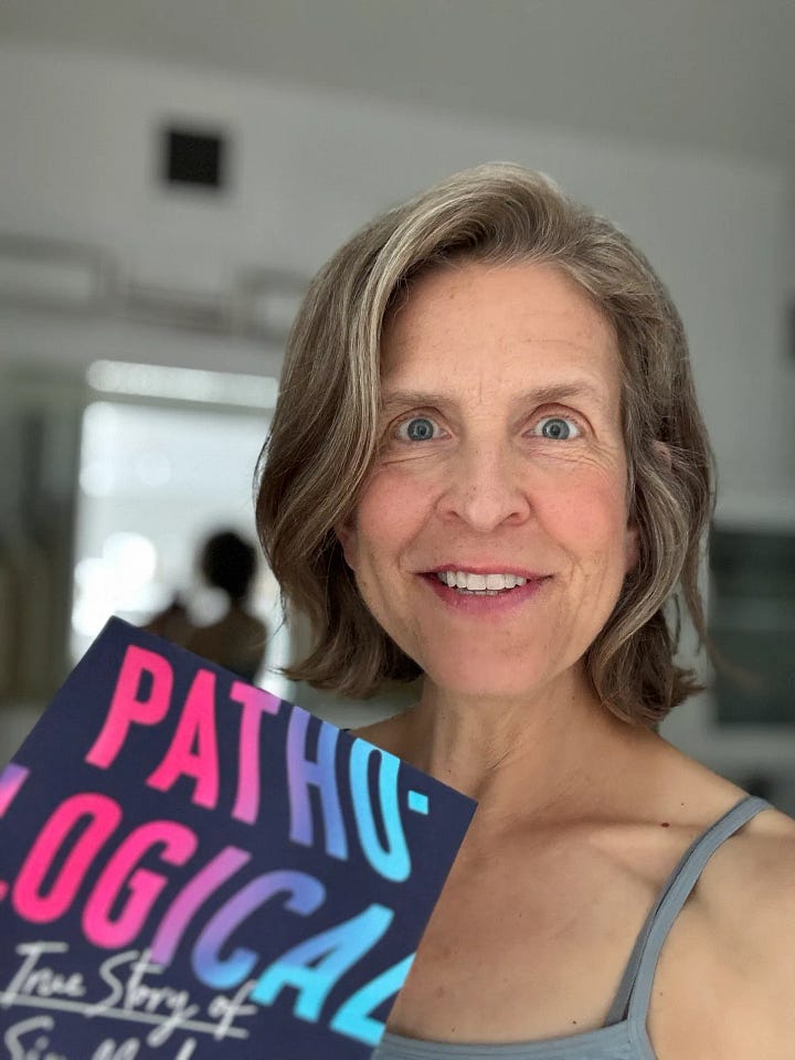 Sarah Fay, delighted, holding Pathological: The True Story of Six Misdiagnosis and the USA Today Best-selling Booklist. We did it! The cookies my team sent me from BBG. Sweets guarding the plate of cookies.