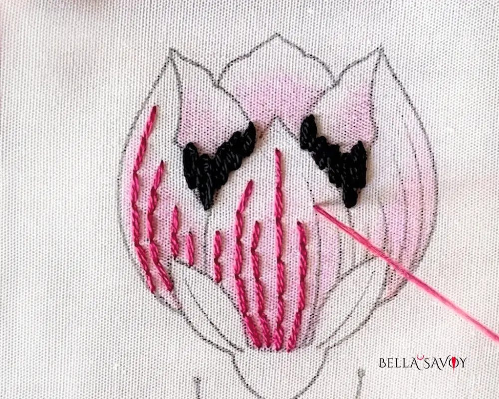 Learn How to Color Fabric with Crayons 127 back stitch being added to flower petal embroidery design