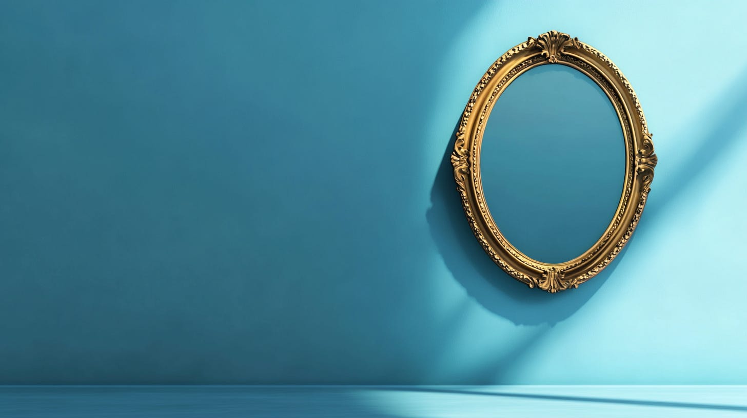 An ornate mirror hanging on a wall.