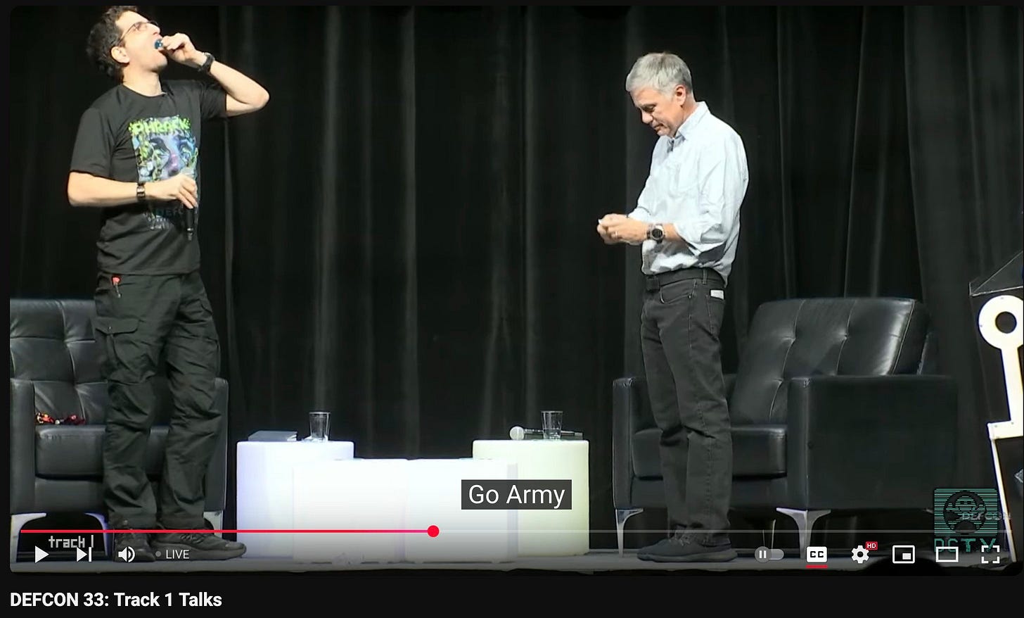 Dark Tangent and war criminal Paul Nakasone taking jello shots after saying "Go Army!" in a pitch to enlist hackers at Defcon to join the US military AI fascist war efforts. Dark Tangent and war criminal Paul Nakasone taking jello shots after saying "Go Army!" in a pitch to enlist hackers at Defcon to join the US military AI fascist war efforts.