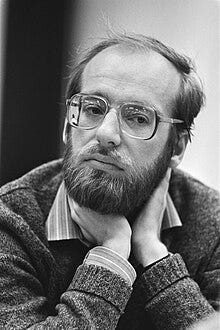May be a black-and-white image of 1 person, beard and eyeglasses