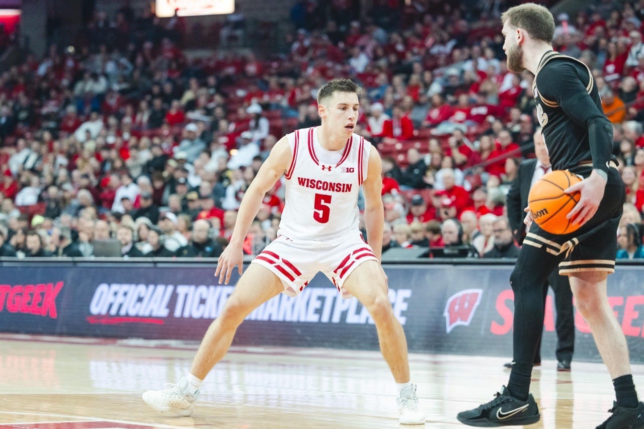 Wisconsin guard Jack Janicki playing on-ball defense against Purdue star guard Braden Smith.