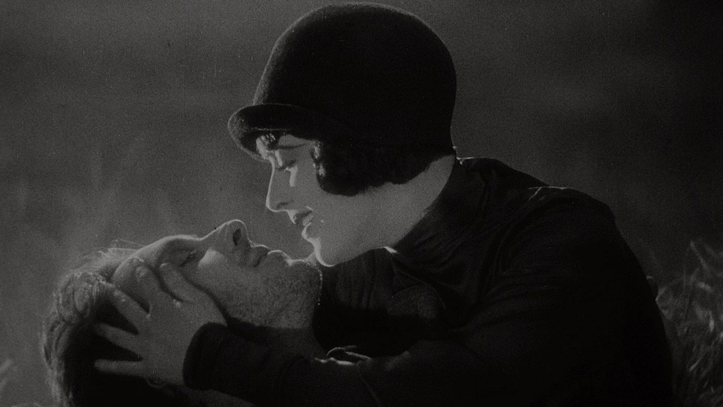 Sunrise: A Song of Two Humans | Still features a man and a woman in a loving embrace.