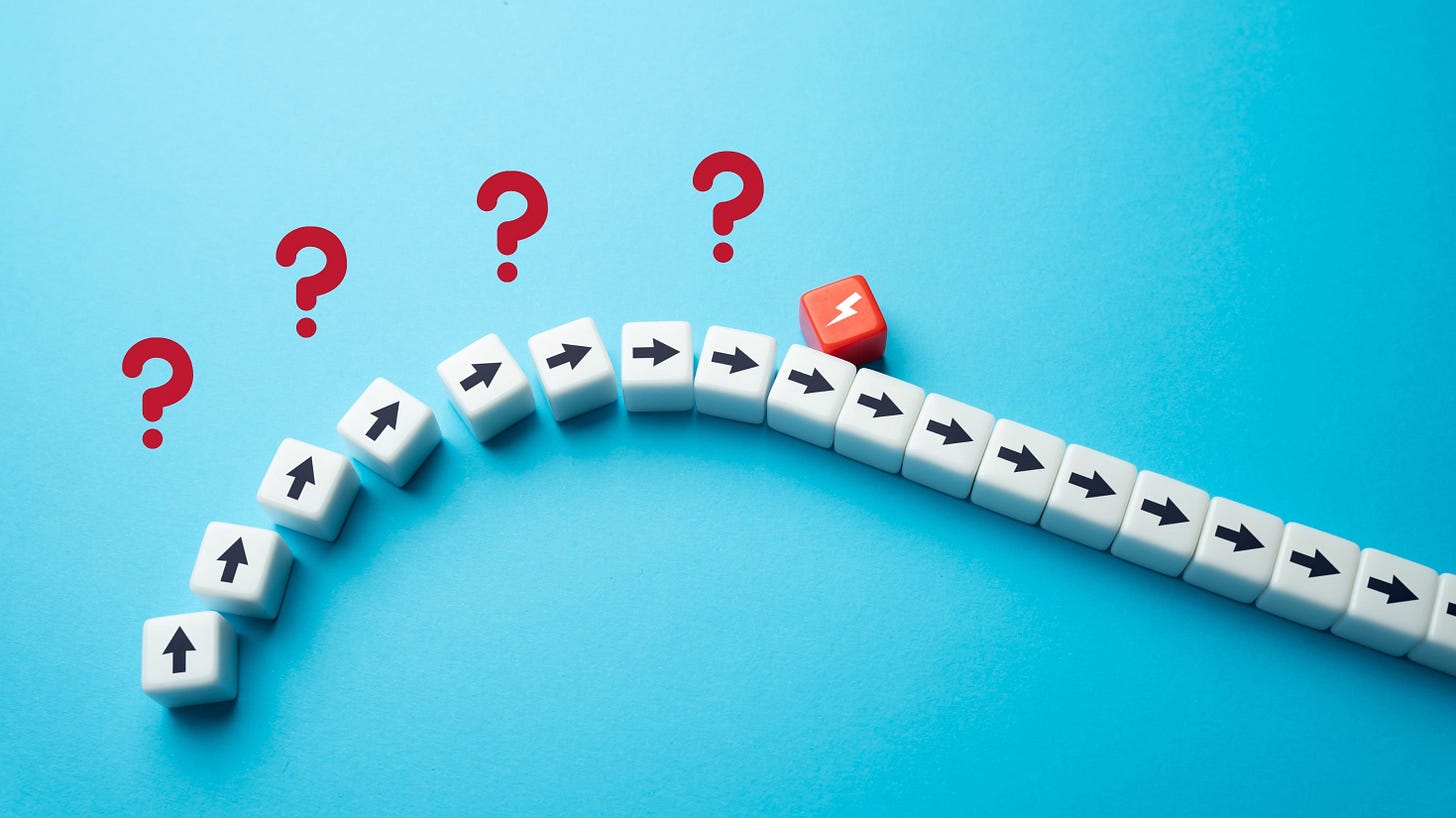 Arrows going up to a lightning bolt and then down with question marks above the upward arrows.