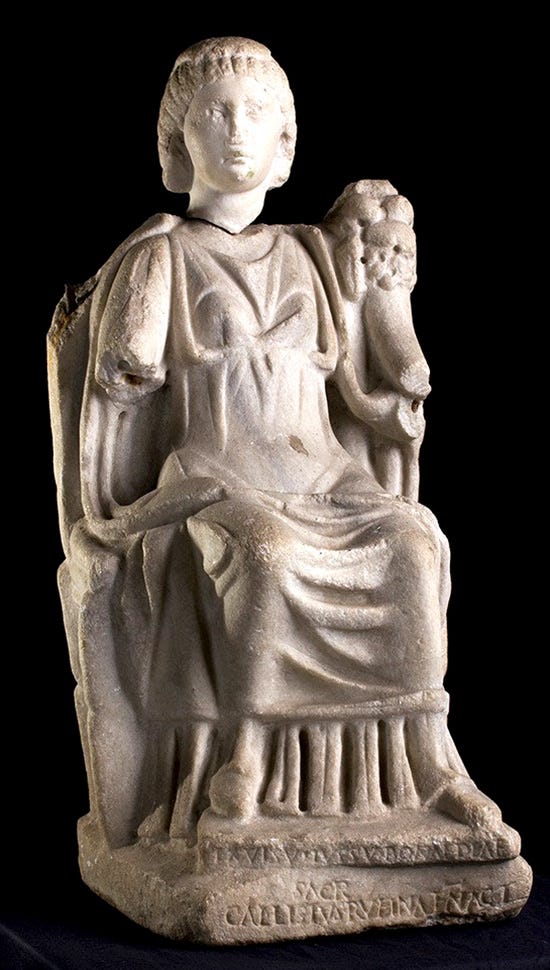 Marble statue of Bona Dea, seated on a chair. The inscription at the base reads “Ex visu iussu Bonae Deae sacr(um) Callistus Rufinae N(ostrae) Act(or)” — in translation, “Statue dedicated to Bona Dea by Callistus, agent of our Rufina, because of a vision, by order (of the goddess).” Marble statue of Bona Dea, seated on a chair. The inscription at the base reads “Ex visu iussu Bonae Deae sacr(um) Callistus Rufinae N(ostrae) Act(or)” — in translation, “Statue dedicated to Bona Dea by Callistus, agent of our Rufina, because of a vision, by order (of the goddess).”