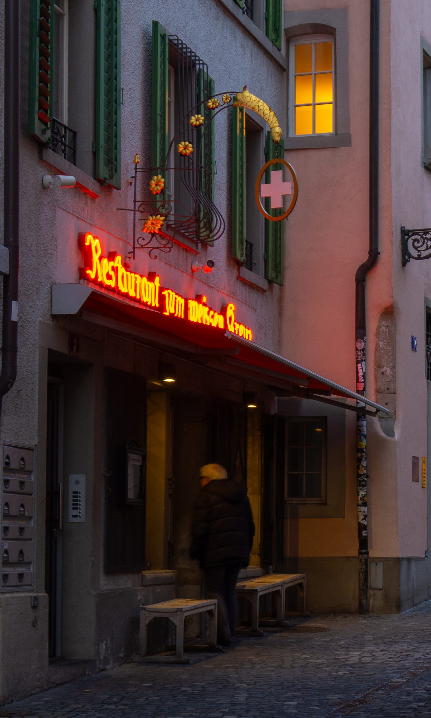 A man walking into a pub