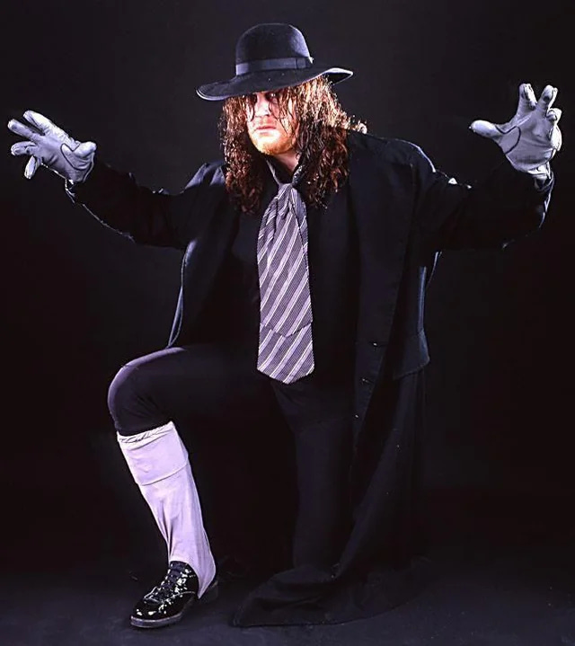 A picture of The Undertaker from 1990 who is standing on one leg for some reason