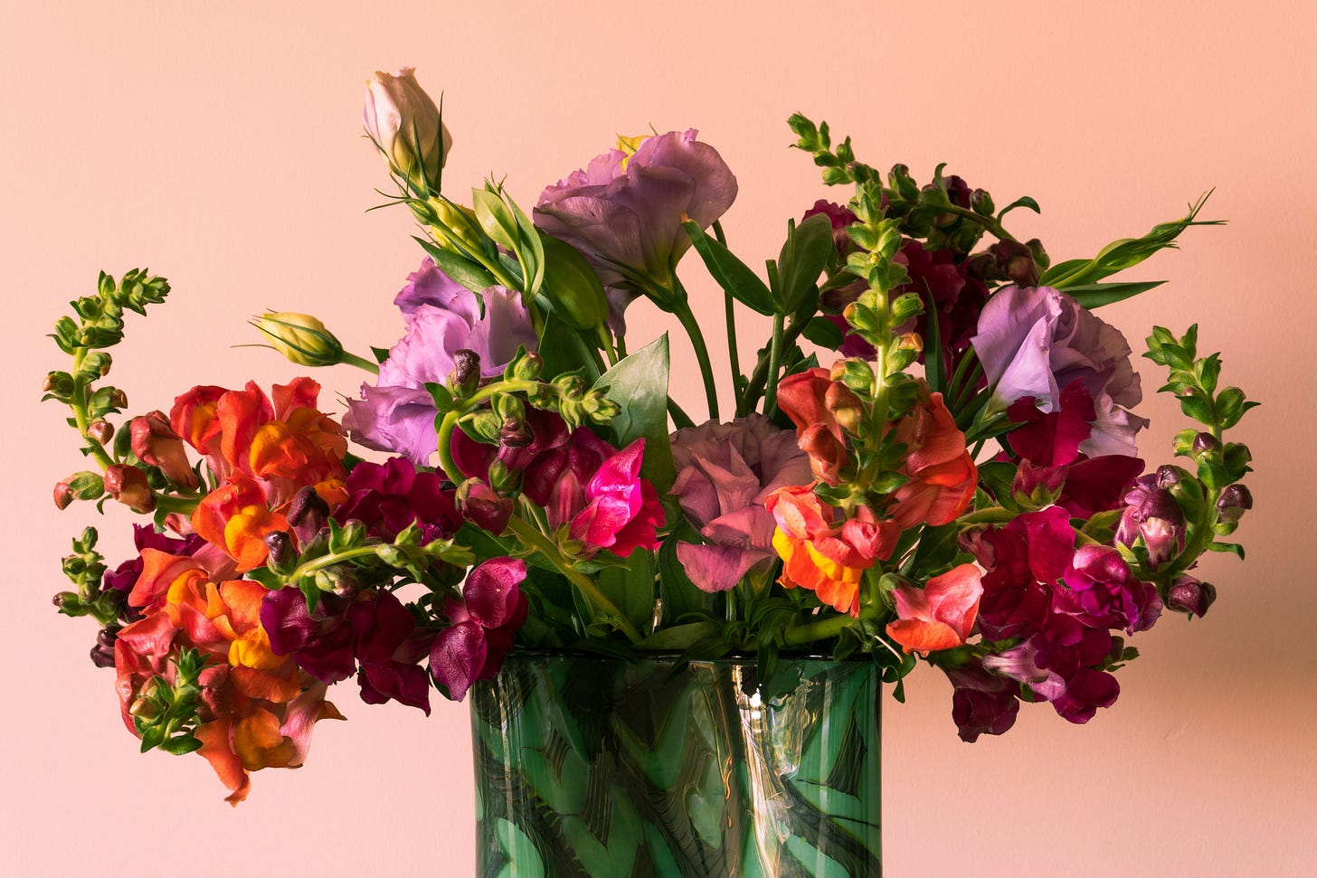 Purple and orange flowers in a vase