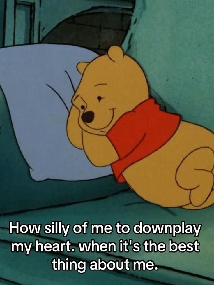 This may contain: winnie the pooh is laying in bed with his arms around him and saying how silly of me to downplay my heart, when it's the best thing about me
