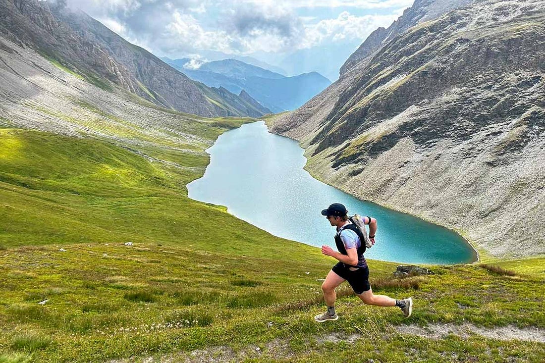 CJ Carter running in front of lake