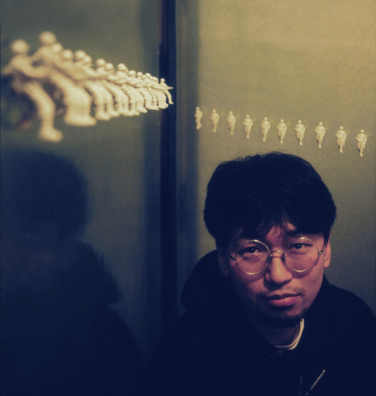 Takashi Murakami with early works at Galerie Mars, Tokyo, 1992