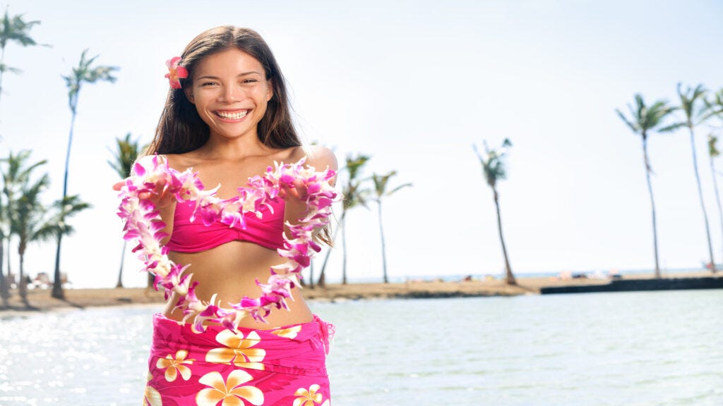 Oahu Islanders Welcoming Guests By Giving Them Lei - Image From Shutterstock