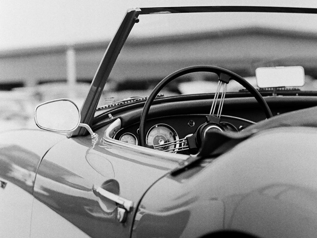 grayscale photo of classic car grayscale photo of classic car
