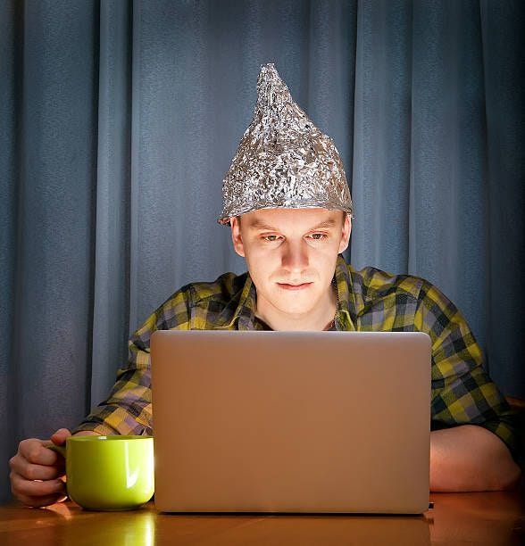 tinfoil hat against mass media tinfoil hat against mass media tin foil hat stock pictures, royalty-free photos & images
